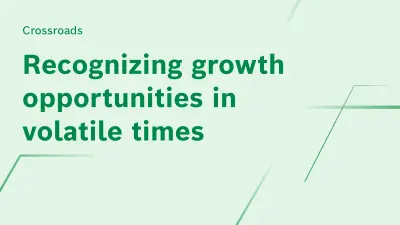 "Crossroads, recognizing growth opportunities in volatile times" is written in green on a light green background