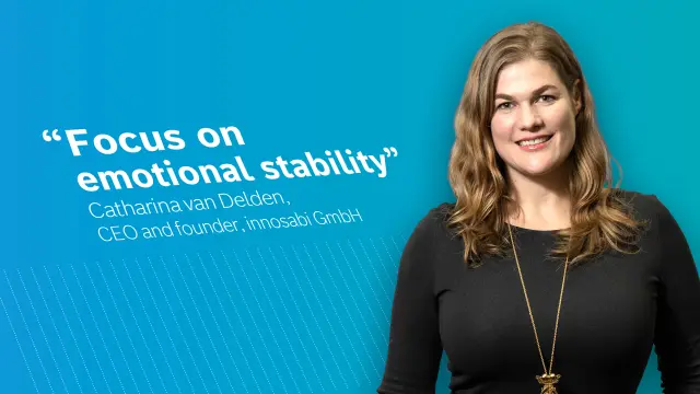 Catharina van Delden, Founder and CEO of innosabi GmbH in front of a blue background.