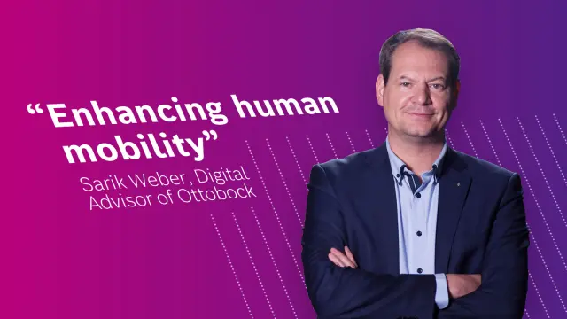 Sarik Weber, Digital Advisor at Ottobock in front of a pink background