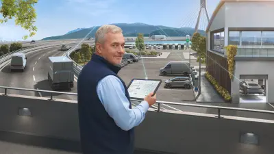 Man with tablet and many vehicles