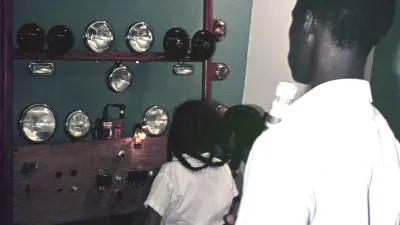 Trade fair display of Bosch automotive lighting equipment, Uganda, 1964