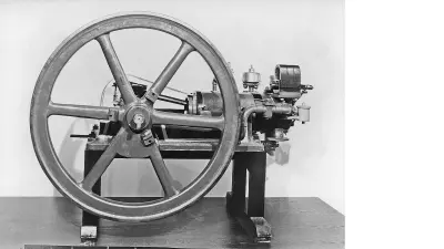 Engine on a pedestal with a large flywheel against a white backgroundBut success was just around the corner. Around 1895, automotive pioneers started misusing a popular product from Bosch’s workshop for their motor vehicles: the magneto ignition device. Such magneto-electrical ignition devices had existed since the 1860s and were used frequently in stationary engines. While Bosch did not invent the technology, the company started offering magneto ignition devices in 1887. Associates would manufacture the individual pieces by hand over a period of weeks. The ignition devices were designed for large, low-speed stationary engines. For Bosch, they were a mainstay, accounting for up to 50 percent of his small workshop’s sales as the 1890s began. Because motor vehicles featured much smaller engines that had to operate at a far higher speed in order to provide the necessary output, ignition proved to be the “trickiest problem,” as one automotive pioneer put it.
