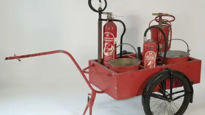 Bicycle trailer with fire extinguisher, 1960