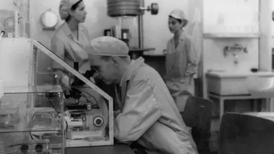 Scientist using a microscope