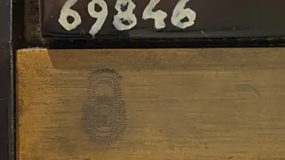 Oval embossed on a piece of metal