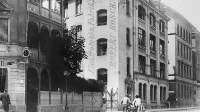  A row of buildings. One wall bears the words “Robert Bosch.”