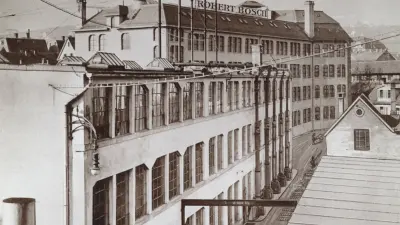 Two buildings, one behind the other, with large windows. One roof bears the words “Robert Bosch.”