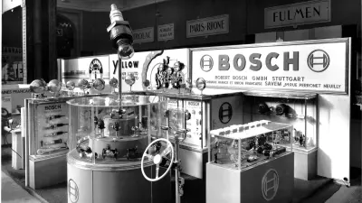 Bosch exhibition stand with showcases for various automotive parts.