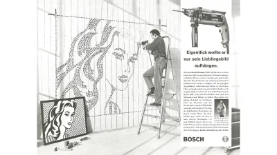 Man creates a mural with a drill
