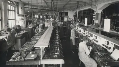 Six women and a supervisor in a workshop