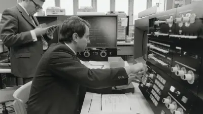 Two experts operating a mainframe computer, 1971