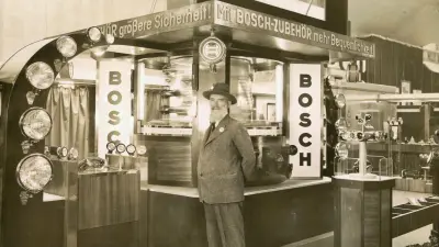 Robert Bosch in front of a booth