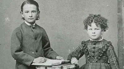 Two children standing at a table