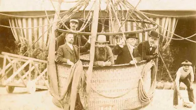 Robert Bosch is standing in the basket of a hot air balloon with four other gentlemen.