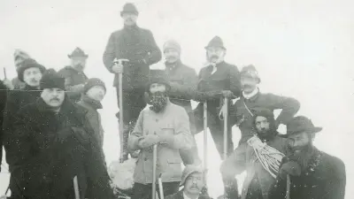 A group of alpinists on the top of a mountain