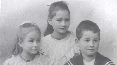 Three children in half-portrait