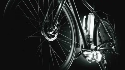 Three-quarter silhouette of a bicycle with electric drive from the left. The battery and motor can be seen.