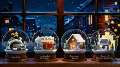 Vier Schneekugeln auf einer Fensterbank mit Motiven: Mobility, Industrial Technology, Consumer Goods, and Energy & Building Technology.