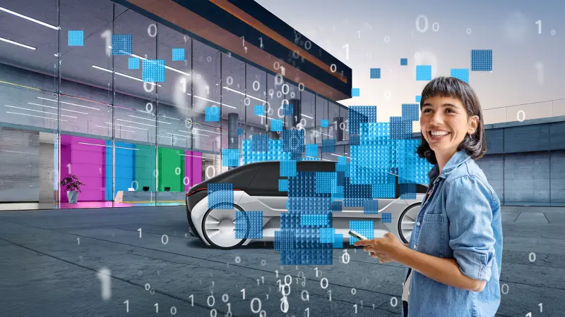 Eine Person mit Smartphone steht vor einem modernen Gebäude und einem futuristischen Auto.