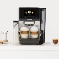 A coffee machine with two prepared coffee drinks