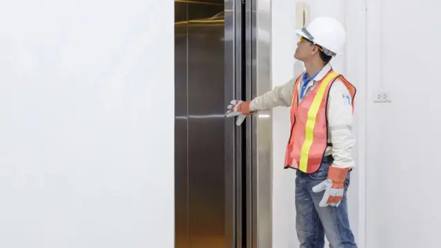 Man in front of a lift