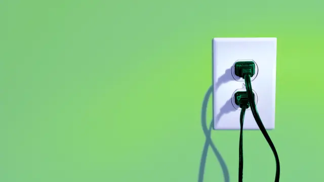 Wall socket in which two plugs are inserted horizontally