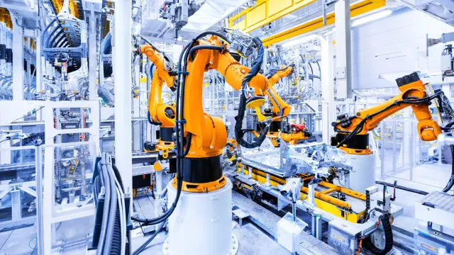 The image shows use of robotic arms for incorporation of digital twins.