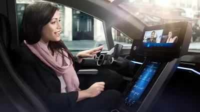 Woman in modern vehicle interior interacting with advanced dashboard display and AI-powered infotainment system, demonstrating intelligent automotive services and connected mobility solutions.