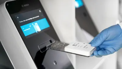 A Bosch Vicalytic test cartridge is inserted into the Vivalytic laboratory diagnostics platform.