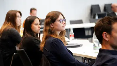 Students of the Bosch Research Foundation sitting in the audience listening to a presentation at the 2025 event in Renningen.
