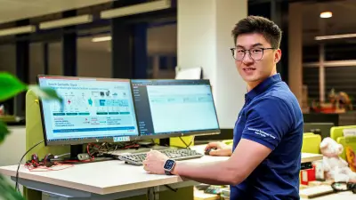 Dr. Wan Ding working in the office of the Engineering Software Department at Bosch Connected Industry, China.