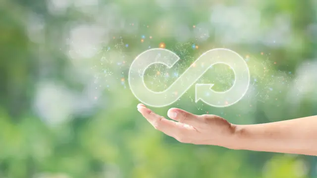 At Bosch Research, we are looking at ways of conserving resources when manufacturing various Bosch products. The graphic shows a green, slightly blurred landscape in the background and in the foreground a plant growing from two hands. The hands are surrounded by icons which symbolize sustainable activities at Bosch Research.