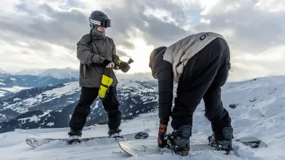 Snowboarders Yanneck Konda and Moritz Amsuess preparing for a run.