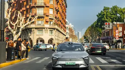 Car driving through a busy city intersection