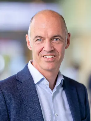 Person wearing a suit jacket and shirt indoors