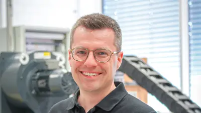 Bosch researcher Matthias Kraenzler with the AI-based Smart Test Facility Automation project at the Bosch Research Campus in Renningen, Germany.