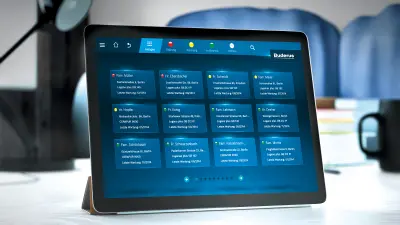 An iPad on a desk. On it, the app for controlling the connected products portal can be seen