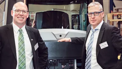 Johannes-Jörg Rüger, the head of CVO, in front of the Genius Cab.