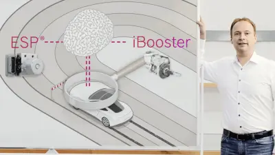 The car brakes with its dual braking system and stops.
