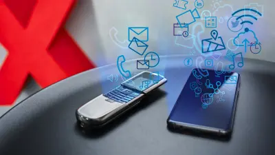 A push-button handheld and a smartphone side by side. Only a few icons are emanating from the push-button handheld, but many diverse ones from the smartphone.