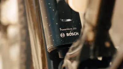 Close-up of a Bosch PowerMore 250 range extender mounted on an e bike frame.