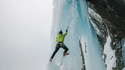 Extreme climber Bernard Witz climbs an icefall. You can see parts of his equipment and tools such as helmet, pimple, rope, carabiner and crampons.
