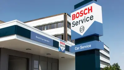 A Bosch Car Service center sign and building exterior. The sign displays the Bosch logo and the words "Bosch Service" and "Car Service".
