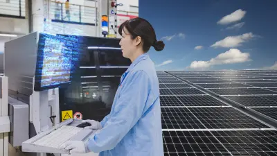 A split image shows a person working on a computer inside a factory. The other side shows solar panels