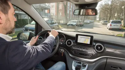 The image shows a driver in his car.