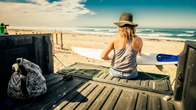 The image shows a women on a tailgate.