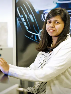 Bosch associate Sharon Jacob, a woman in a white sweater, smiles at the camera.