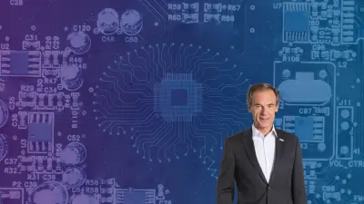 Dr. Volkmar Denner im Vordergrund und ein stilisiertes Gehirn auf einer Leiterplatte im Hintergrund