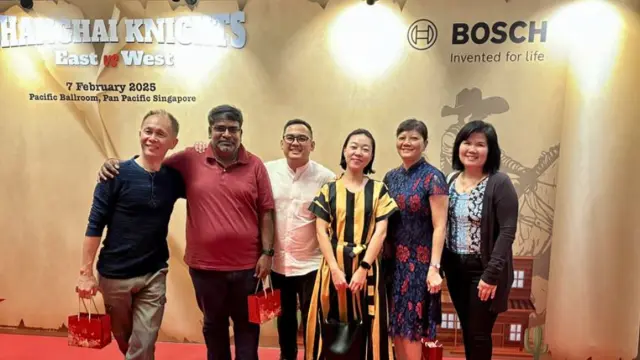 Namin from Singapore smiles for the camera together with five colleagues.
