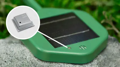Close-up of the Silvanet forest fire detection system. The gas sensor, a small silver square, is highlighted as a macro shot with a graphically depicted magnifying glass.